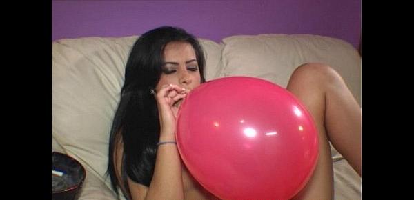  Ava Jay blows to pop balloons